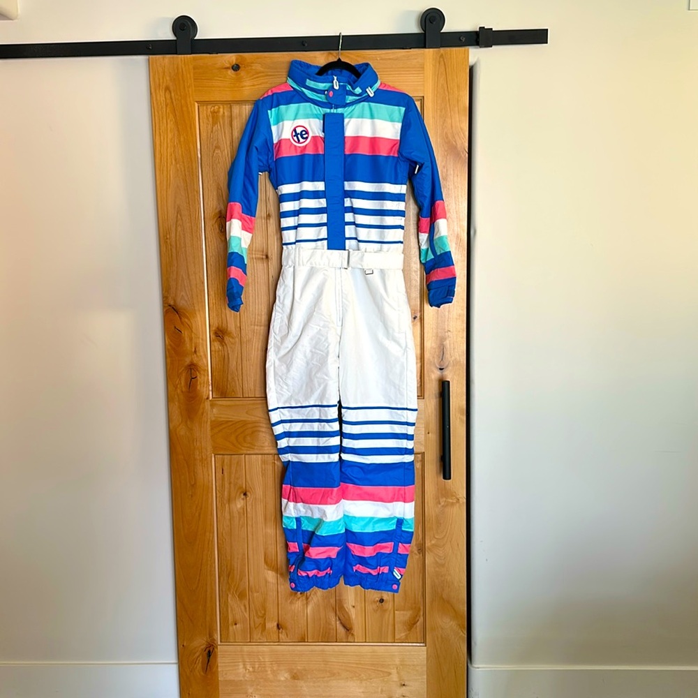 Women’s Small Tipsy Elves Ski suit. White with blue and pink stripes.
